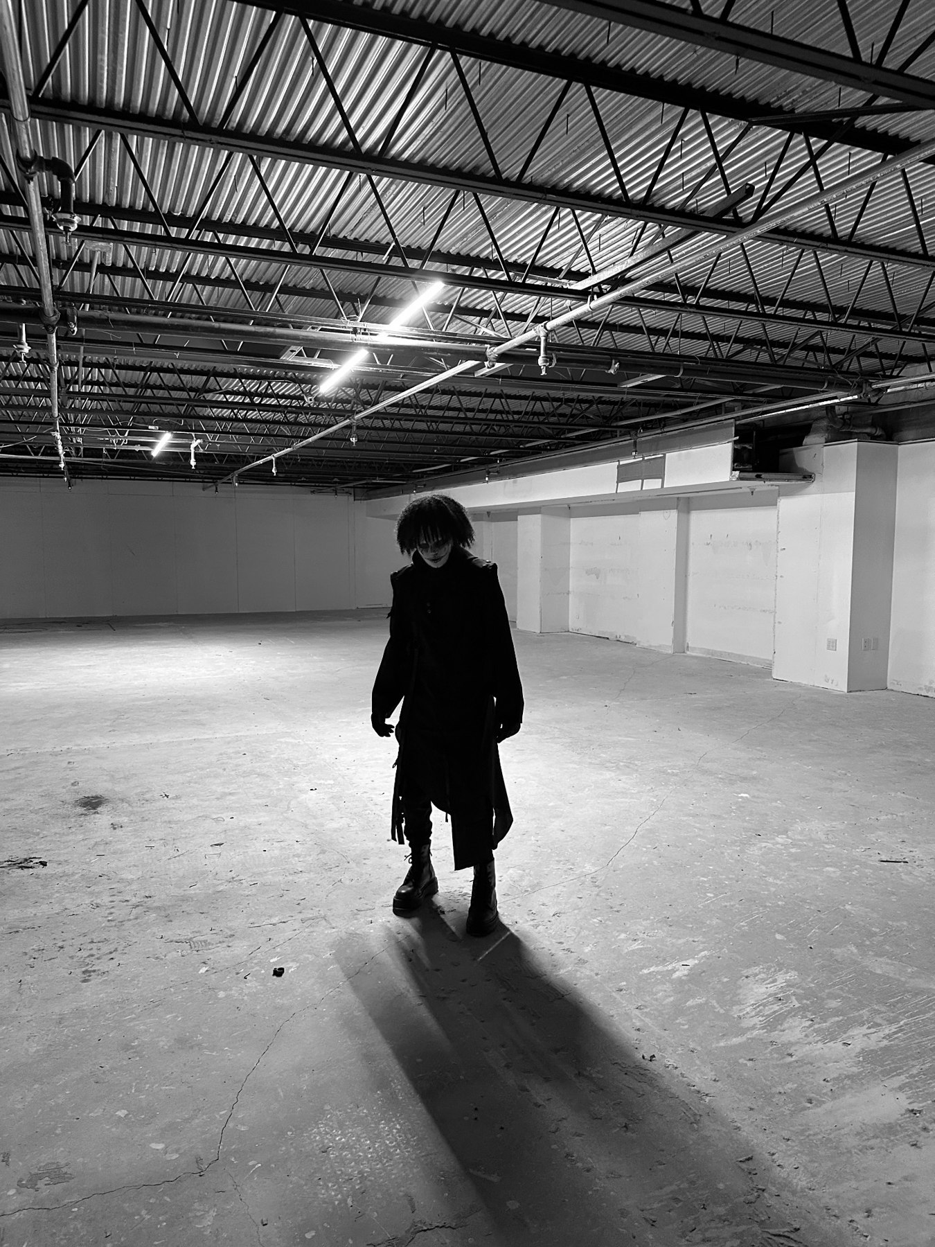 Phantomix standing in an industrial room